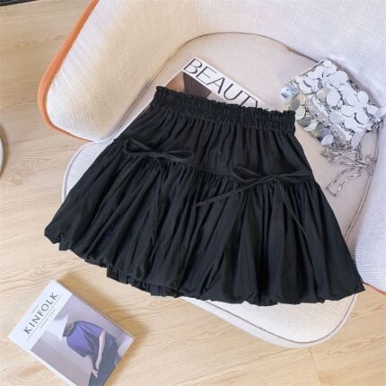 The Odette Bow Pleated Mini Skirt